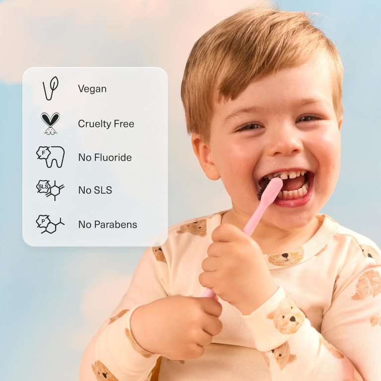 A young child smiling while brushing their teeth, holding a pink toothbrush. Next to them, a list of product attributes: Vegan, Cruelty Free, No Fluoride, No SLS, and No Parabens.