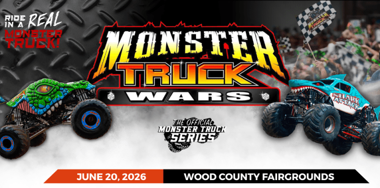 Promotional image for the Monster Truck Wars event featuring two monster trucks, a green truck with a dinosaur design and a blue truck with a shark design, set against a steel background. Text includes event details: 'June 20, 2026', 'Wood County Fairgrounds', and 'The Official Monster Truck Series'.